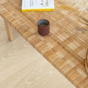Detail shot of Quick-Step Frosty Beige Oak laminate showing natural wood grain texture