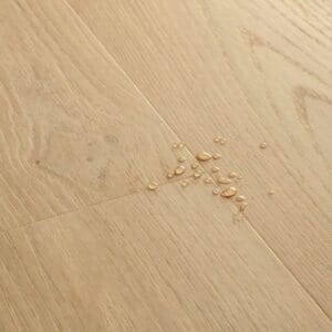 Full room view of Coast Oak Beige flooring installed in a modern living space with natural light