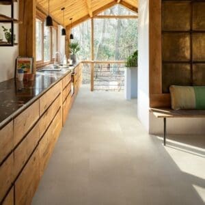 Modern kitchen with wooden ceiling and Sandstone Concrete flooring