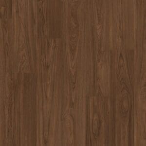 Quick-Step Capture Chic Walnut laminate flooring in a bright living space with large windows