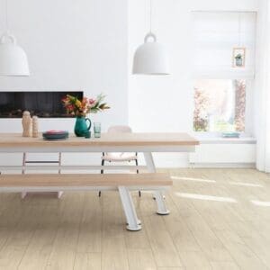 Bright dining area with wooden table and Quick-Step Havana Oak Natural flooring