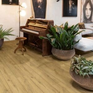 Living room with piano, artwork and honey oak laminate flooring