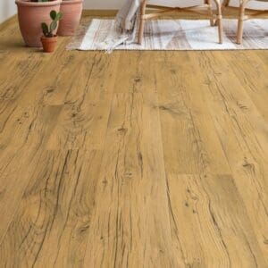 Living room with Quick-Step Capture Cracked Oak Natural Laminate flooring featuring rattan furniture and cactus plants