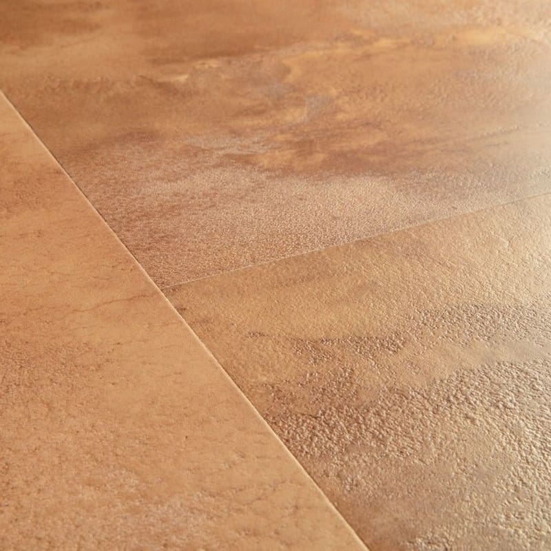 Quick-Step Muse Terracotta Laminate Flooring MUS5490 close-up showing water resistance with droplets on surface