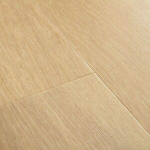 Close-up of Quick-Step Alpha Blos Drift Oak Beige vinyl flooring showing plank joints and texture