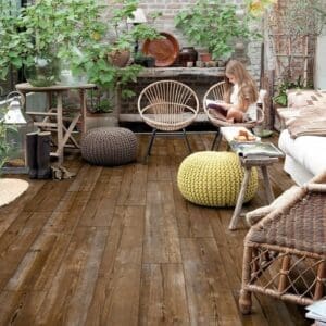 Quick-Step Alpha Bloom Sundown Pine flooring installed in a conservatory setting with natural light