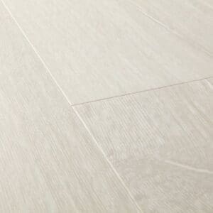 Detailed view of Quick-Step Impressive Patina Classic Oak Light laminate planks showing authentic wood appearance