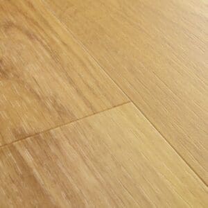 Close-up view of Quick-Step Alpha Blos Classic Oak Natural vinyl flooring showing plank joints and texture