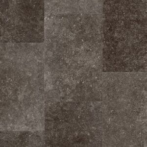 Quick-Step Muse Fumed Bluestone laminate flooring sample showing dark grey stone-effect tiles with natural speckles and variations