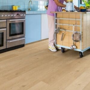 Kitchen with Coast Oak Beige flooring showing durability in high-traffic area