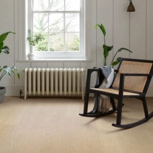 Buttermilk Oak flooring in minimalist room with rocking chair and white walls