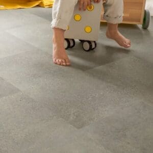 Child's playroom with Quick-Step Alpha Oro Concrete Rock flooring and yellow teepee