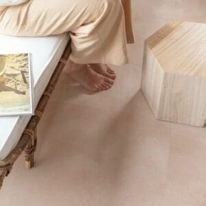 Person sitting on furniture with Soft Blush vinyl flooring underneath