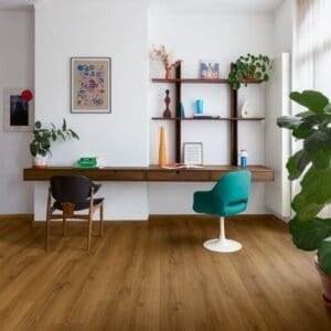 Close-up of Quick-Step Botanic Caramel Oak flooring showing water droplets demonstrating waterproof quality