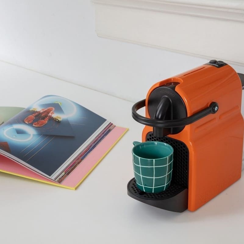 Coffee machine on countertop with Quick-Step Alpha Oro Coral Rock vinyl flooring visible