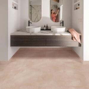 Bathroom vanity area with Soft Blush vinyl flooring and marble countertop