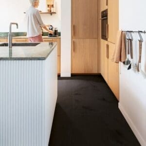 Modern kitchen with Quick-Step Black Slate Laminate flooring installed
