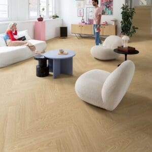 Modern living room with Quick-Step Alpha Ciro Pure Oak Blush flooring featuring contemporary furniture and decor