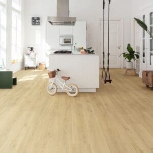 Modern kitchen with light cabinetry and Quick-Step Botanic Beige flooring