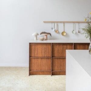 Modern kitchen with Quick-Step Muse Botanic Concrete flooring and wooden cabinetry
