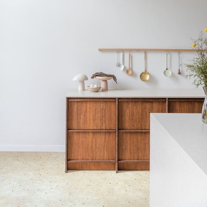 Modern kitchen with Quick-Step Muse Botanic Concrete flooring and wooden cabinetry