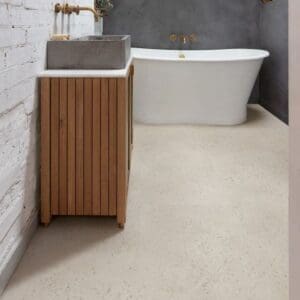 Modern bathroom featuring mint green tiles and Oyster Concrete flooring