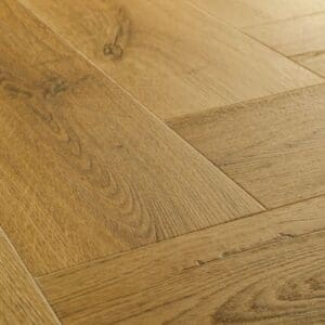 Close-up detail of Quick-Step Alpha Ciro Botanic Smoked Oak flooring showing natural wood grain texture
