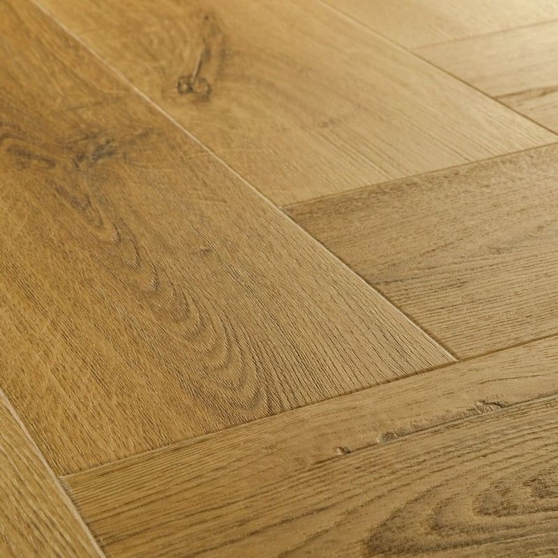Close-up detail of Quick-Step Alpha Ciro Botanic Smoked Oak flooring showing natural wood grain texture