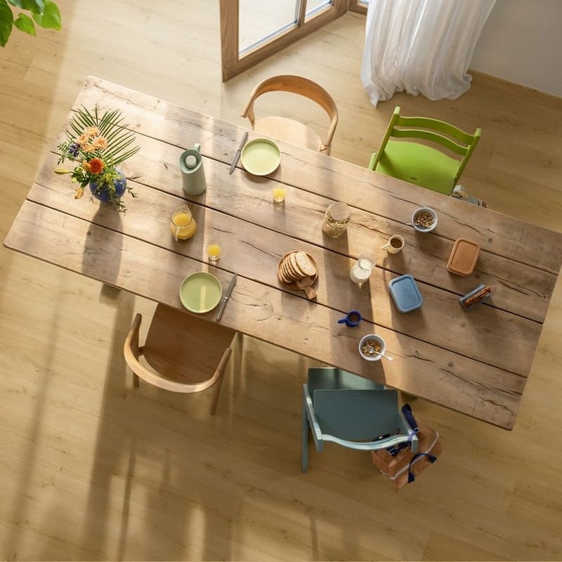 Child helping with bathtub on Quick-Step Alpha Bloom Brushed Oak Honey vinyl flooring