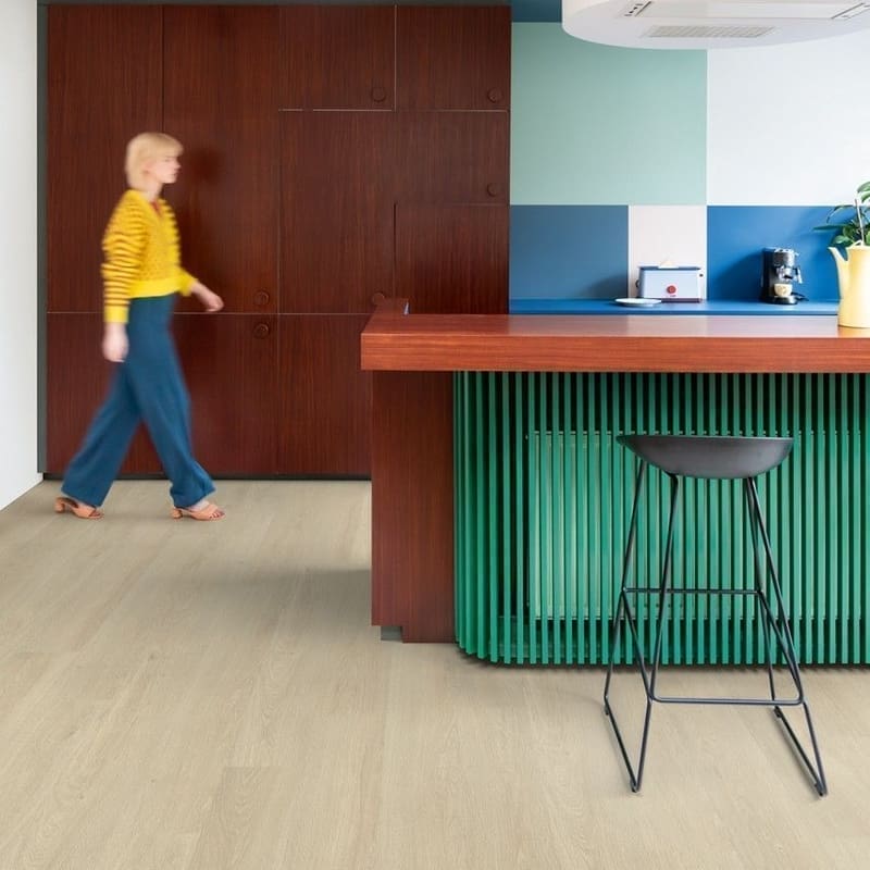 Child drawing on floor with Sea Breeze Oak Beige vinyl flooring