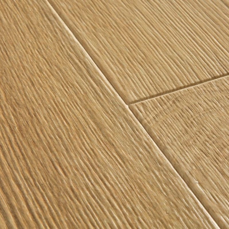 Quick-Step Desert Oak Warm Natural laminate flooring in a music room with piano and stylish decor