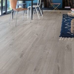 Person exercising on Cotton Oak Cozy Grey flooring demonstrating its durability