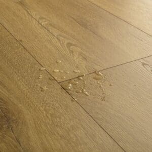Close-up of water droplets on waterproof honey oak laminate flooring