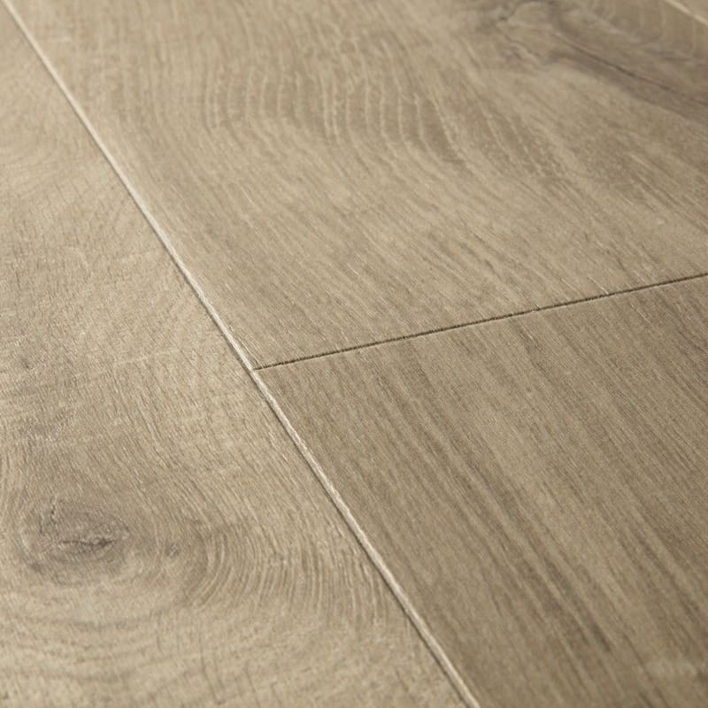 Close-up detail of Quick-Step Impressive Ultra Soft Oak Light Brown laminate showing wood grain texture and plank joints