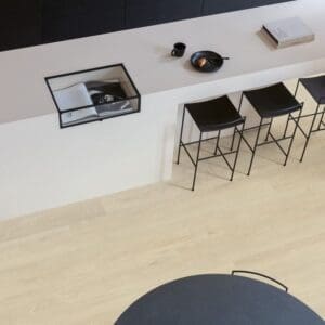 Close-up of Sea Breeze Oak Beige vinyl flooring texture showing natural wood grain detail