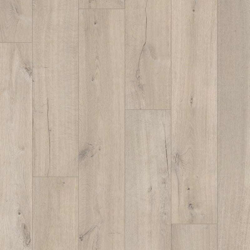 Close-up of Quick-Step Impressive Soft Oak Light laminate flooring showing authentic wood grain texture and beveled edges