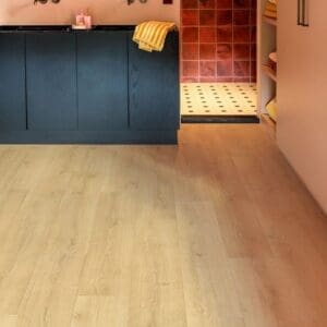 Quick-Step Capture Brushed Oak Natural laminate flooring in a bathroom with stylish vanity unit and mirrors