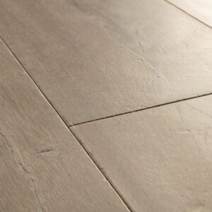 Detail of Quick-Step Patina Oak Brown laminate showing texture and surface finish