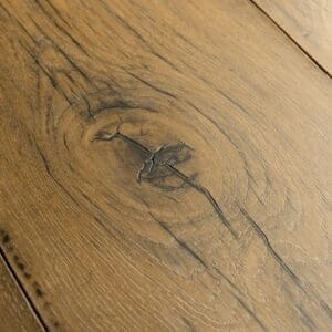 Close-up view of Quick-Step Capture Cracked Oak Natural Laminate planks showing joint connection