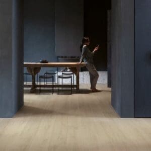 Modern living room with Quick-Step Brushed Oak Beige laminate flooring and minimalist furniture