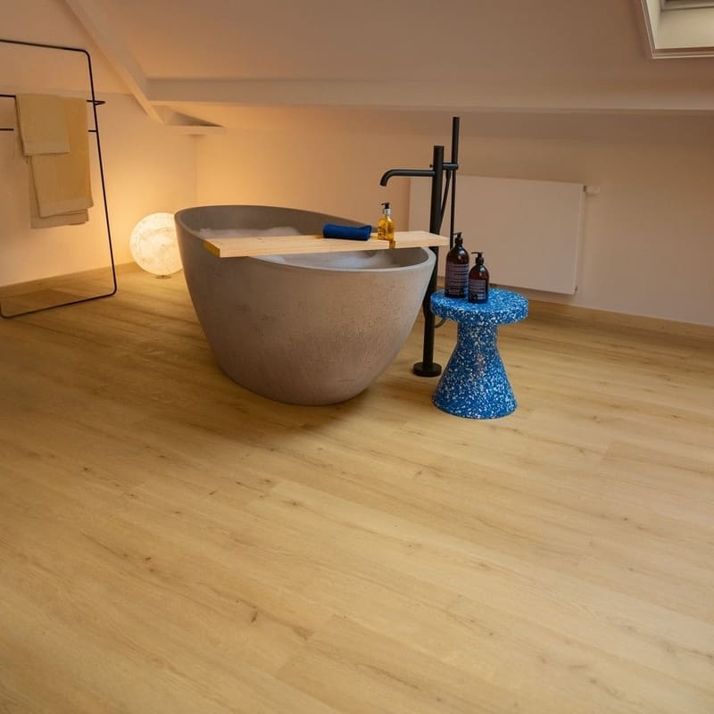 Family dining area with wooden table and Quick-Step Alpha Bloom Brushed Oak Honey vinyl flooring