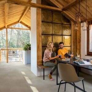 Open concept kitchen and dining area with Sandstone Concrete flooring