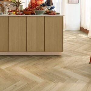 Quick-Step Alpha Ciro Botanic Beige Herringbone flooring in kitchen with counter and strawberries