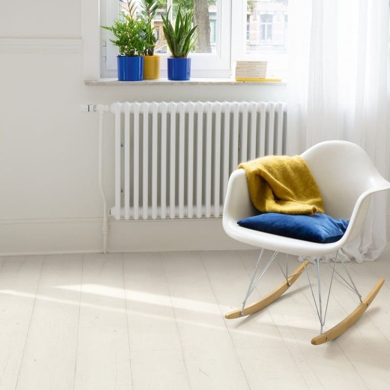 Close-up of white laminate flooring showing authentic wood texture