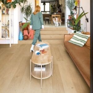 Living room with Coast Oak Beige flooring featuring contemporary furniture and decor