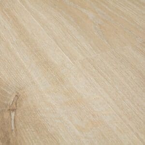 Close-up detail of Quick-Step Creo Tennessee Oak Light Wood laminate showing grain texture