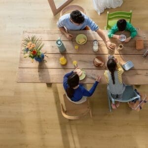 Detailed view of plank joints in Quick-Step Alpha Bloom Brushed Oak Honey vinyl flooring