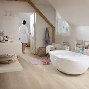 Attic office space with Sea Breeze Oak Beige flooring and wooden beams