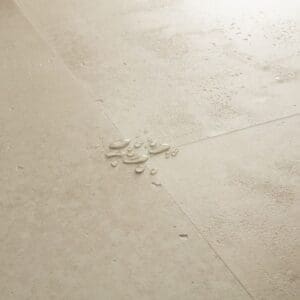 Full room view of installed Sandstone Concrete flooring in tile pattern