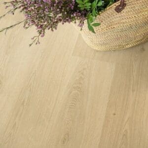 Woven basket with flowers on Quick-Step Botanic Beige flooring showing natural wood appearance